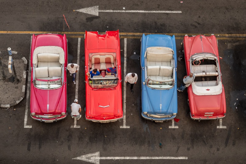 Men looking after their cars, Havana, Cuba.
